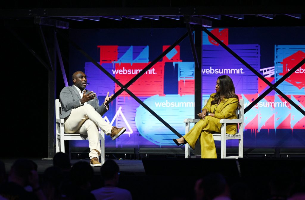 Sol Campbell, Former Footballer, Arsenal & England; left, and Samantha Johnson, Presenter & Journalist, Al Jazeera; on SportsTrade Stage during day one of Web Summit 2023 at the Altice Arena in Lisbon, Portugal. Photo by Lukas Schulze/Web Summit